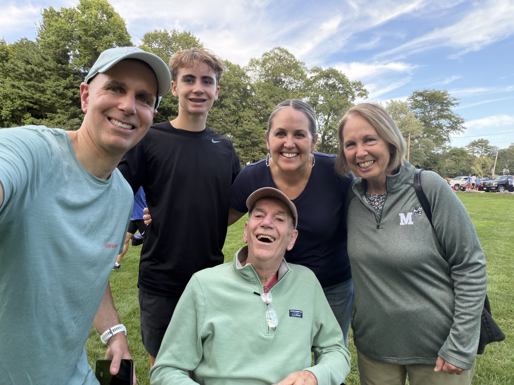 Bobby in a black shirt with his grandparents and family after the meet.